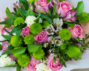 Bouquet of green chrysanthemums, roses and alstroemeria. Background