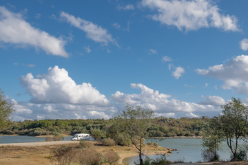 recreation van RV at border of lake in Santiago Maior, Portugal