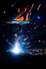 .The process of welding metal in complete darkness.