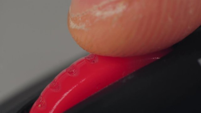 Macro finger scrolls and pushes presses the wheel on computer mouse. Surfing internet and social networks, reading news feed. Desk jockey or office monkey concept. Scrolling