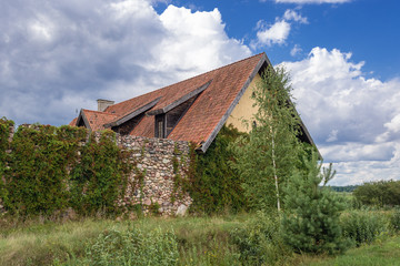 Fototapeta na wymiar Side view of replica of mediaeval castel in Kiermusy, small village in Podlasie region of Poland