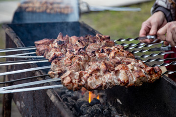 Grilled meat skewers. cooking barbecue