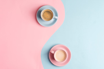 Creative pastel blue pink background as a symbol of infinity with two ceramic cups of freshly...