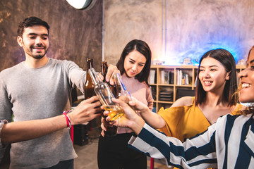 corporate, celebration and holidays concept - happy friends or team with party accessories taking selfie at office.business team eating wine  at the loft office party.