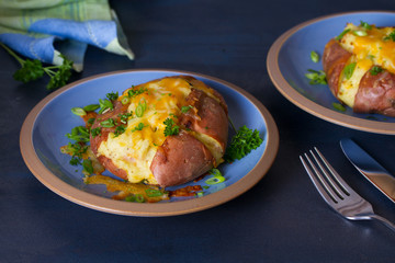 Twice Baked Potatoes with Bacon, Cheese and  Scallion. Potato in jacket. Horizontal image