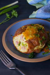 Twice Baked Potatoes with Bacon, Cheese and  Scallion. Potato in jacket. Vertical image