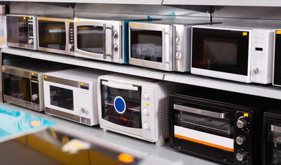 Image of assortment of a kitchen microwave at household  appliances store