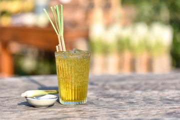 Herbal drink lemongrass on the old wood texture,natural patterns with knots and nail holes. lemon...
