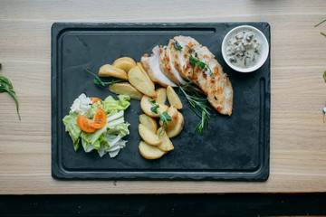 griled chicken breast steak with vegetable (broccoli,carrot,onions)