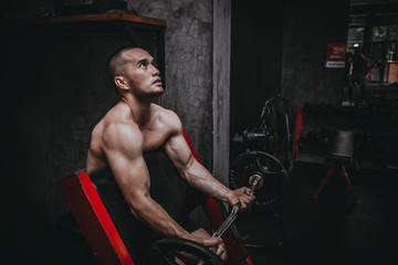 Fototapeta na wymiar Portrait of asian man big muscle at the gym,Thailand people,Workout for good healthy,Body weight training,Fitness at the gym concept,Prank to abdominal muscles,Lift up barbell