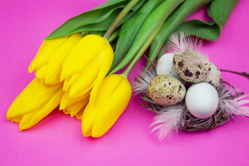 Easter eggs. Happy easter card. Multi-colored Easter. Easter eggs on a pink wooden background....
