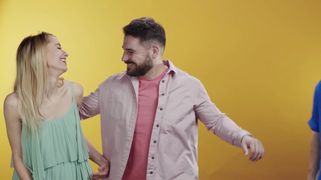 Hipster romantic couple holding hands smiling cheerful on background. Bearded funny man retakes his ex-girlfriend hugging together. Interpersonal relationship.