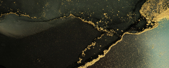 Abstract black and gold color background. Marble texture. Alcohol ink colors.