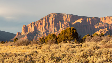 A part of Zion National Park known as the Kolob Fingers catches the last rays of a winter day with...