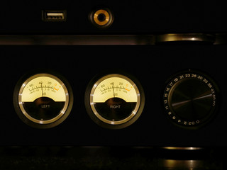 Stereo integrated amplifier with decibel potentiometer. Close-up view.