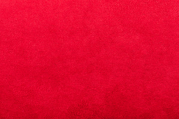red suede texture, close up of textile material with copy space.