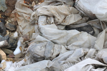 Fototapeta na wymiar Construction waste with plastic wasteelements at municipal landfill