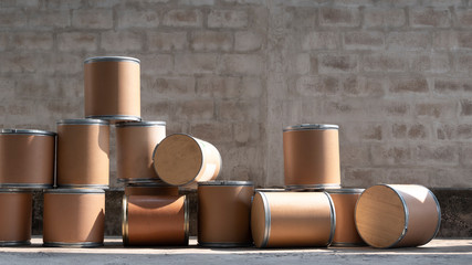 Group of the old brown paper buckets [paper tank] for reuse and recycle in front of concrete wall background in storage area  
