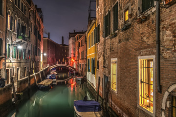 Small canal in Venice at night