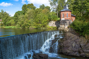 The picturesque view of Vanhakaupunki, the oldest part of Helsinki. The Vantaa river landscape, old...