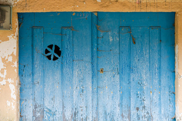 Old wooden door painted blue, Galicia. Spain.