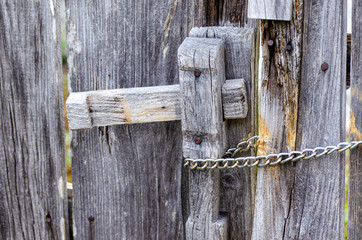 Antique wood door worn and unpainted by time