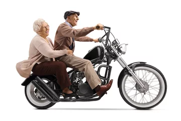 Cercles muraux Moto Senior man and woman riding on a custom motorbike