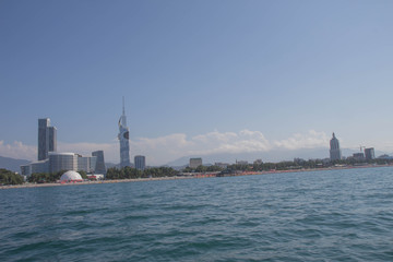Naklejka premium View Of Embankment Of Georgian Resort Town Of Batumi. Sea And Modern Urban Architecture Skyscrapers. View From Sea