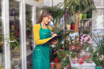 Pretty Young Florist Arranging Delivery 