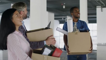 Successful businessman and his diverse team establishing a business with new office in downtown