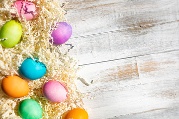 Bright And Colorful Easter Eggs On Weathered Wood