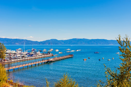 Marina in Tahoe City, California, USA on summer day in september. The state of Nevada is visible across the water.