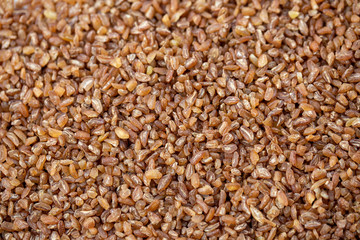 raw bulgur wheat background texture. top view