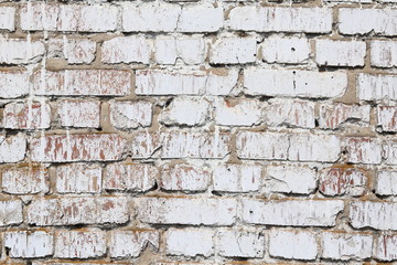 Old wall made of red brick, painted white in loft style for modern designer interior of room, bar or restaurant