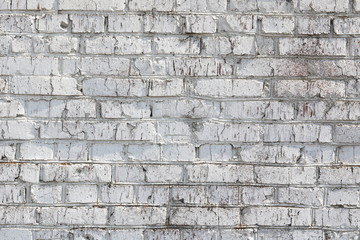 Old wall made of red brick, painted white in loft style for modern designer interior of room, bar or restaurant