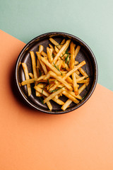 plate with french fries on color background. menu concept