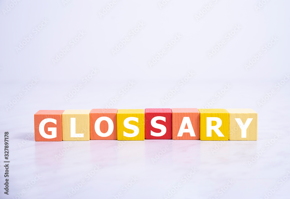 Fototapete glossary - word from wooden blocks with letters, alphabetical list with words meanings dictionary gl