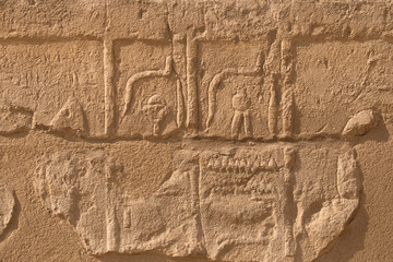 Karnak Temple, complex of Amun-Re. Embossed hieroglyphics on walls. Luxor Governorate, Egypt.