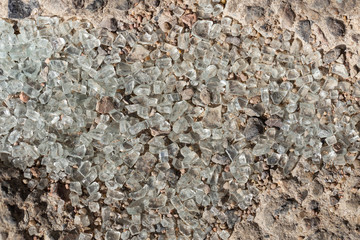 Broken glass on the asphalt. Traces of a car accident on the ground. After the disaster.