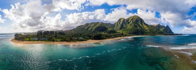 Aerial panoramic image off the coast over Tunnels beach on Hawaiian island of Kauai with Na Pali...
