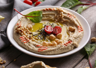 Oriental cuisine. Traditional snack hummus. It includes chickpeas, pine nuts, olive oil, spices and...