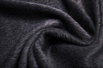Soft and warm folded alpaca wool blanket. Grey wool plaid texture macro shot. Wool plaid texture...