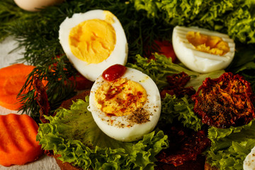 Fresh boiled egg with lettuce, parsley and dill. Healthy nutrition. Morning breakfast. Healthy organic natural food concept. View from above