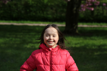 Cute smiling girl in the park