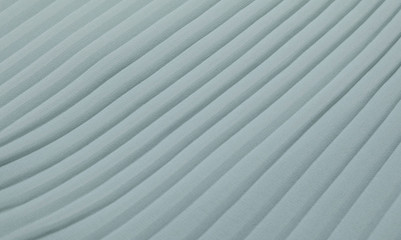 Pleated mint fabric on a horizontal surface. Sample chiffon.