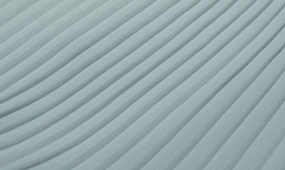 Obraz premium Pleated mint fabric on a horizontal surface. Sample chiffon.