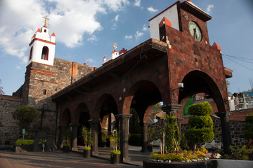 Naklejka premium Streets of Culhuacán welcoming a church with entrance between arches town hall Iztapalapa Mexico