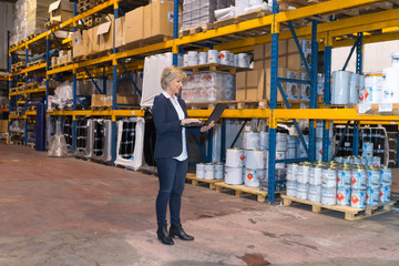 older realtor surveying a warehouse