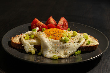 Fried egg with buttered bread 
