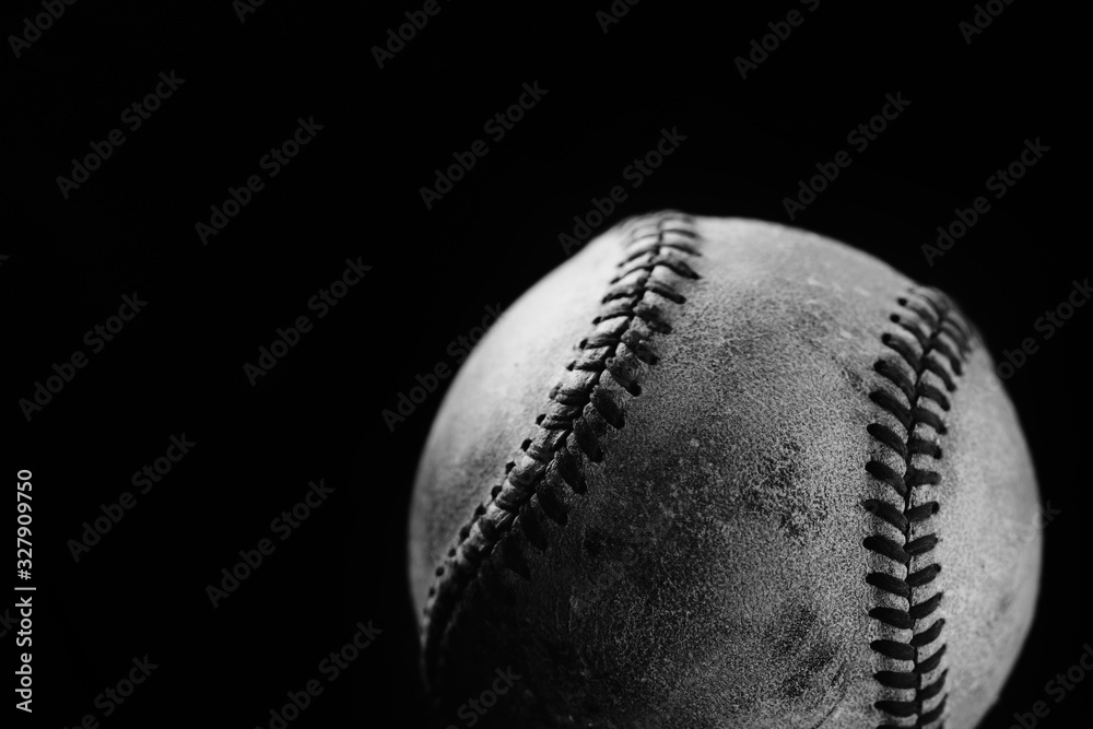 Wall mural macro baseball close up on black background with copy space, old used ball. - Wall murals